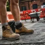 Men's brown safety work boots for construction workers, durable protective footwear with slip resistant sole for site safety